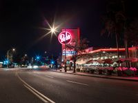 this is a picture of an american food store in california city by night on a city street