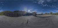 a photo of the view from a skateboard ramp during the day time and time lapsure