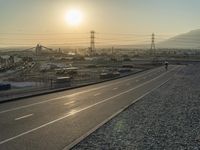 the sunset has been set to turn out on this empty highway in the mountains above town