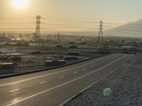 the sunset has been set to turn out on this empty highway in the mountains above town