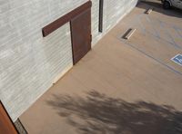 a picture of a car parked outside of a building with one door and one window open