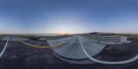 a skateboarder goes off a ramp and into the sunset on an open road