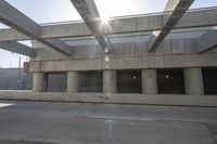 a car that is driving in front of an underground parking lot where no people are standing