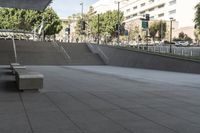 a man on a skateboard going down stairs in front of a building with trees