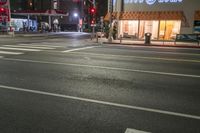 an empty street is shown at night in the city area of san francisco, california