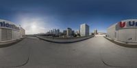 360 - view photograph of the cityscape of a city taken from a fisheye lens