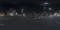 a 3d view of an empty city street at night with lights on the sidewalks and buildings in the background