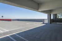 an empty parking garage has no people in it but there's only two cars