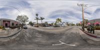 the 360 view camera is showing the street and cars at the curb of the parking lot