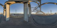 three images with circular mirrors showing the inside and outside views of cars and bridges from the freeway