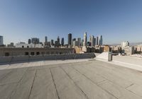 a view of a very wide city from the roof of a building in los angeles, california