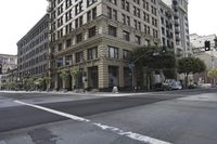 this is a view of a large building that is next to a city street and intersection