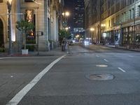 California Urban Road at Night: Lights and Cityscape