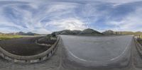 a view of a panoramic of a country road from the camera's point of view