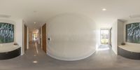 the view in a very large round room shows a circular hallway and the space between them with lots of glass