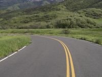 two yellow stripes are painted on the road for the motorists to use as warning