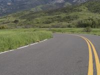 two yellow stripes are painted on the road for the motorists to use as warning