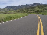 two yellow stripes are painted on the road for the motorists to use as warning