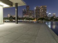 a view of the lights from a city at night with no people around it on the sidewalk