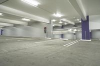 a parking garage with multiple floor and white walls and ceilings and purple beams and a painted ceiling