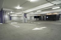 a parking garage with multiple floor and white walls and ceilings and purple beams and a painted ceiling