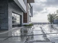 the front walkway is almost empty of people to see as the rain pours down on the ground