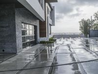 the front walkway is almost empty of people to see as the rain pours down on the ground