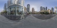 a cityscape and modern architecture are seen in this 360 - view image, making it appear to be distorted