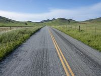 Straight Road Through Lush Green Fields in California, USA