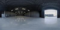 this is an image of a large structure with black metal material and no walls and white floors