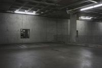 an empty storage room in an industrial building with light coming from the window above the ceiling