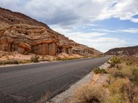 this is a picture of a deserted road in the mountains and deserts to give it a natural feel