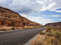 this is a picture of a deserted road in the mountains and deserts to give it a natural feel