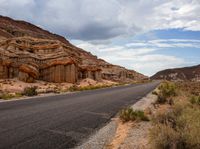 this is a picture of a deserted road in the mountains and deserts to give it a natural feel