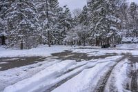 Canada Lake and Residential House on a Snow-Covered Road