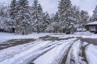 Canada Lake and Residential House on a Snow-Covered Road