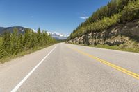 Canada Landscape Road in Lowlands and Majestic Mountains