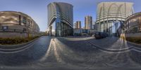 a view of an urban street through spherical lenses of buildings and vehicles parked by