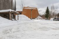 the man is going through the snow to cross the path outside his house, and to enter the cabin and to his side