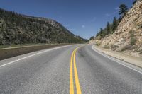 the road is curved at different points of view in this photo and is empty by itself