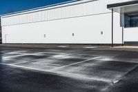 a parking lot that has been watered off with a carwash machine and jet power