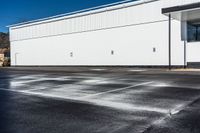 a parking lot that has been watered off with a carwash machine and jet power