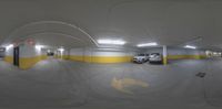 this is an image of a car parking garage area with several parked cars inside of it