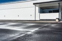 an empty parking lot is dotted with water from a faucet on the pavement