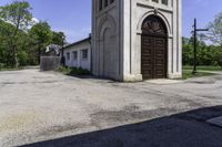 an old church in the middle of the street is empty but there are no people around