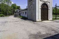 an old church in the middle of the street is empty but there are no people around