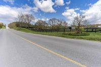 Canada Road through Farm Fields in Green Landscape