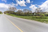 Canada Road through Farm Fields in Green Landscape