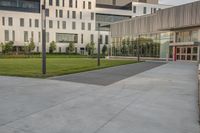 a skate board that is standing on some concrete slabs in front of a building with two glass windows