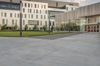 a skate board that is standing on some concrete slabs in front of a building with two glass windows